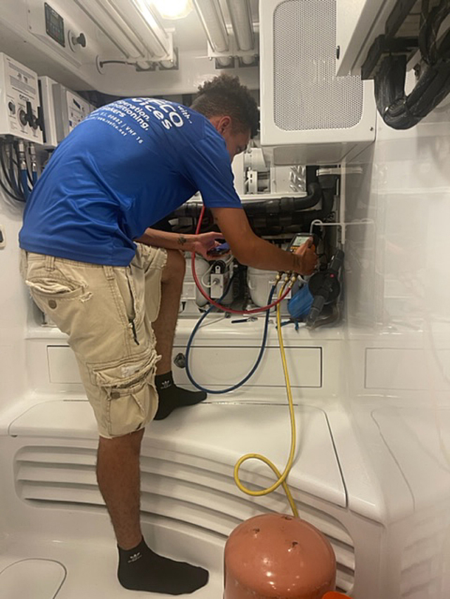 Reefco Services technician with refrigeration meter